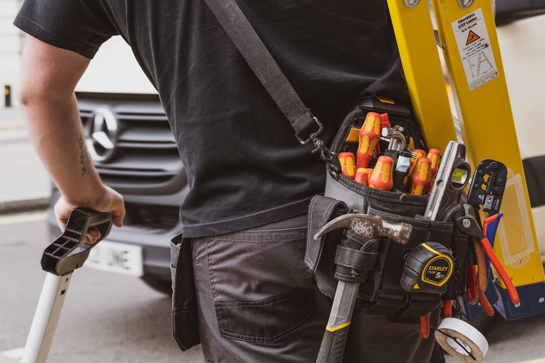 Best Field Service Management Software in 2026: 6 Platforms Compared Field service technician holding tools during a customer service job