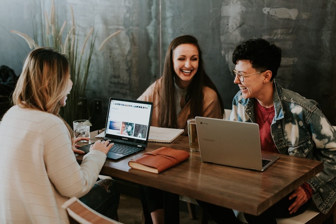 Best Nonprofit CRM Software in 2026: 6 Platforms Compared Nonprofit team collaborating around laptops while evaluating donor CRM software