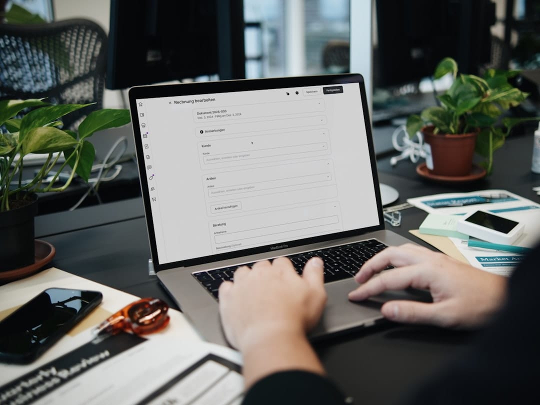 Professional reviewing business software on a laptop for time tracking and billing
