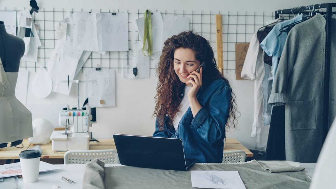 SaaS for Small Businesses: Benefits, Use Cases, Costs & How to Choose in 2026 Small business owner using SaaS software and cloud tools on a laptop